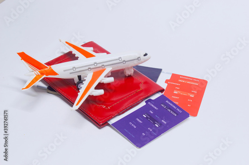 Time to travel. Tourism concept with airplane, boarding tickets and passport.