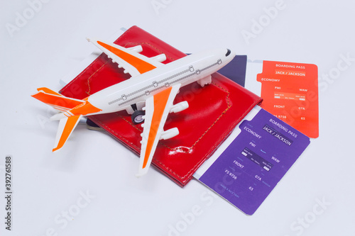 Time to travel. Tourism concept with airplane, boarding tickets and passport.