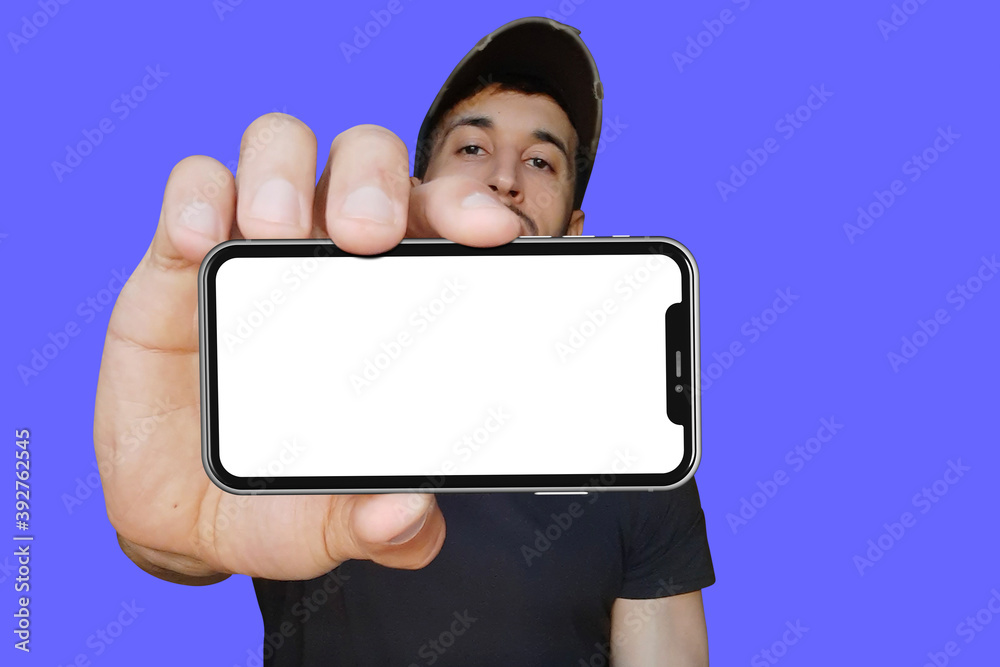 Man holding out hand to show blank white screen of cell phone. Man holding out hand to show blank white screen of cell phone.
