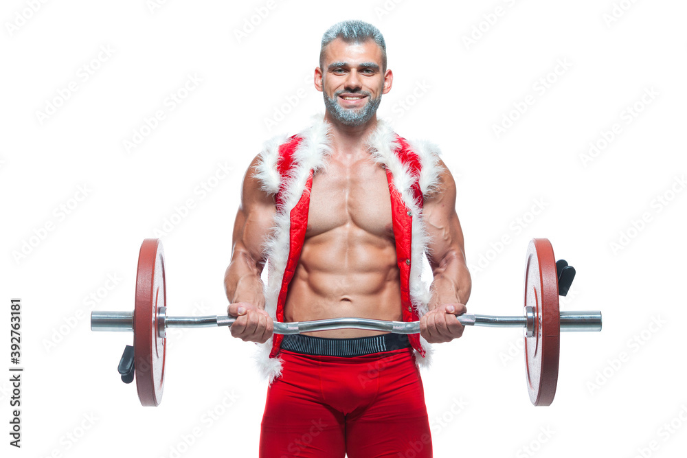 Sexy Santa Claus. Bodybuilder young handsome santa clause smile train muscles arms and biceps at New Years eve and Christmas winter holiday white background. Sexy Santa Claus. Bodybuilder young handsome santa clause smile train muscles arms and biceps at New Years eve and Christmas winter holiday white background.