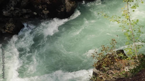 Slow motion view of rapids of the Cheakamus River, running alongside the Sea. Canada. photo