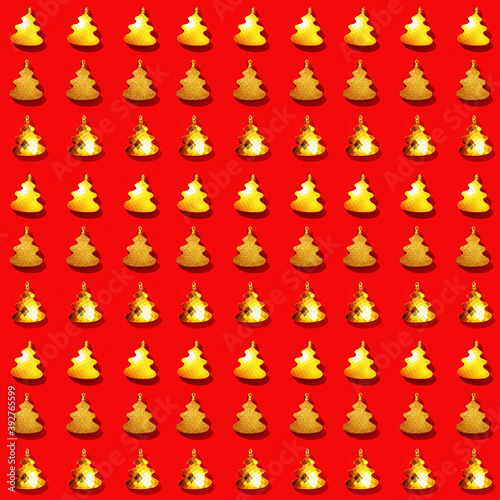 Seamless regular creative pattern with metallic golden Christmas tree toys on red color.