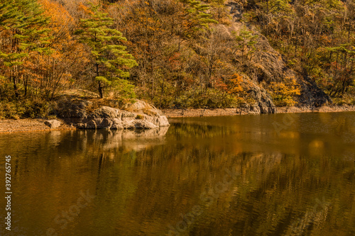 Large boulder on far side of mountain river