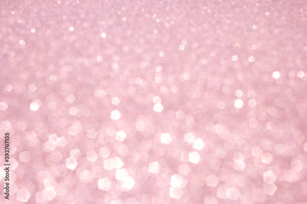 Defocused abstract pink twinkle light background. Pink glittery bright shimmering background use as a design backdrop. Defocused abstract pink twinkle light background. Pink glittery bright shimmering background use as a design backdrop.