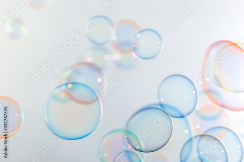 Beautiful shiny colorful soap bubbles floating in the air. Abstract, Natual fresh summer background.