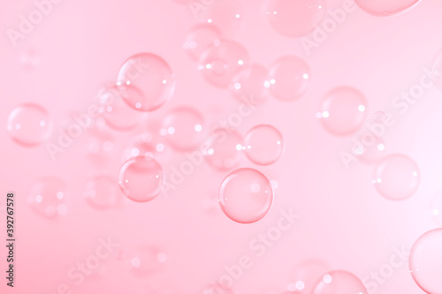Pink soap bubbles floating in the air. Natural freshness summer holiday background.