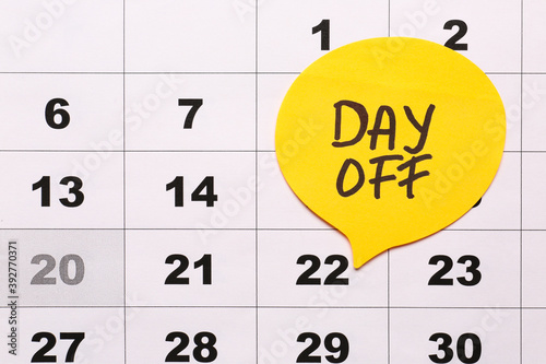 Calendar with marked day of...