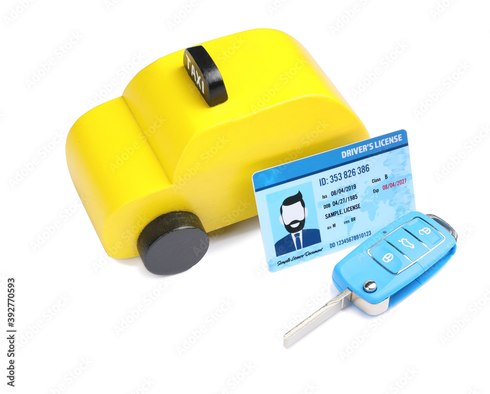 Driving license with car and key on white background