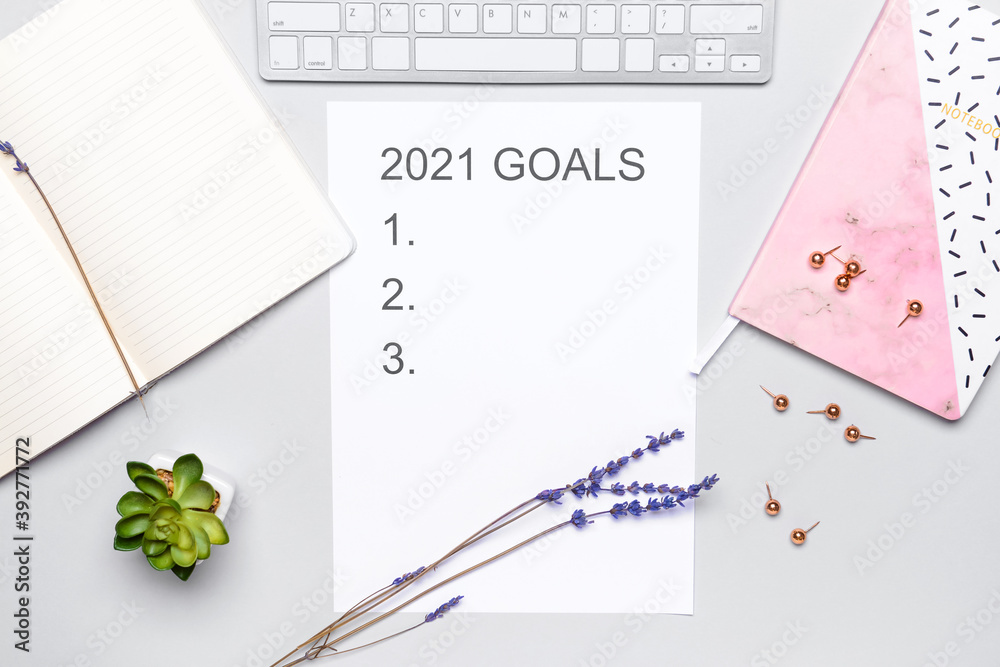 Empty to do list on 2021 year with computer and stationery on light background Empty to do list on 2021 year with computer and stationery on light background