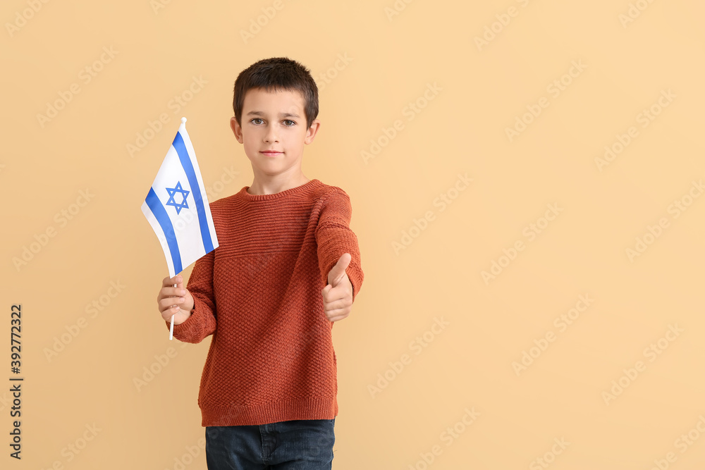 Little boy with the flag of Israel showing thumb-up on color background Little boy with the flag of Israel showing thumb-up on color background