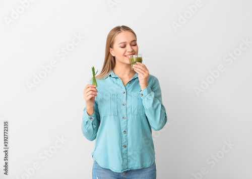 Young woman with wheatgrass...