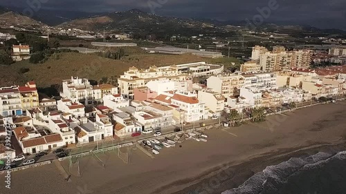 Axarquia beach in Costa del Sol, Málaga, Andalusia, Spain. Aerial view of the shore and houses photo