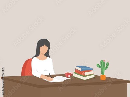 Student studying with book, pretty young girl writing on her working desk.