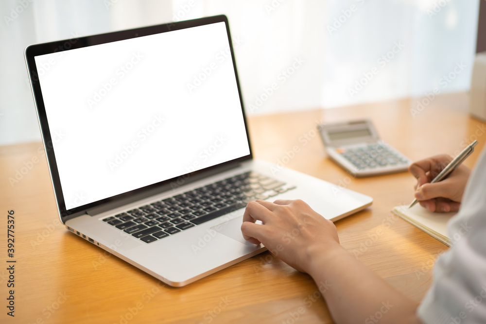 Unrecognizable Asian happy woman using her personal laptop computer for working and making a video conference Unrecognizable Asian happy woman using her personal laptop computer for working and making a video conference