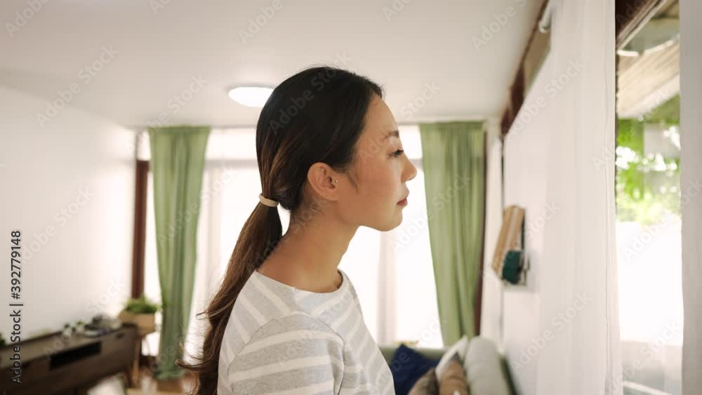 Young man proposing his girlfriend with engagement ring at home. Asian woman getting surprised by her boyfriend with marriage proposal Young man proposing his girlfriend with engagement ring at home. Asian woman getting surprised by her boyfriend with marriage proposal