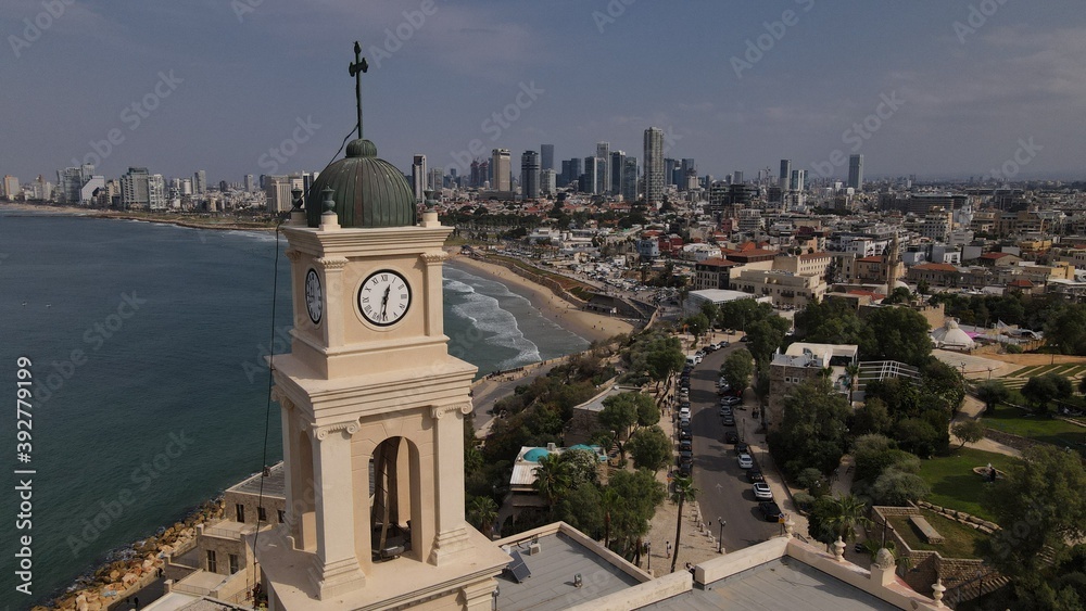 Tel Aviv - Jaffa, view from above. Modern city with skyscrapers and the old city. Bird's-eye view. Israel, the Middle East. Aerial photography. Sea, skyline and blue cloudless sky
