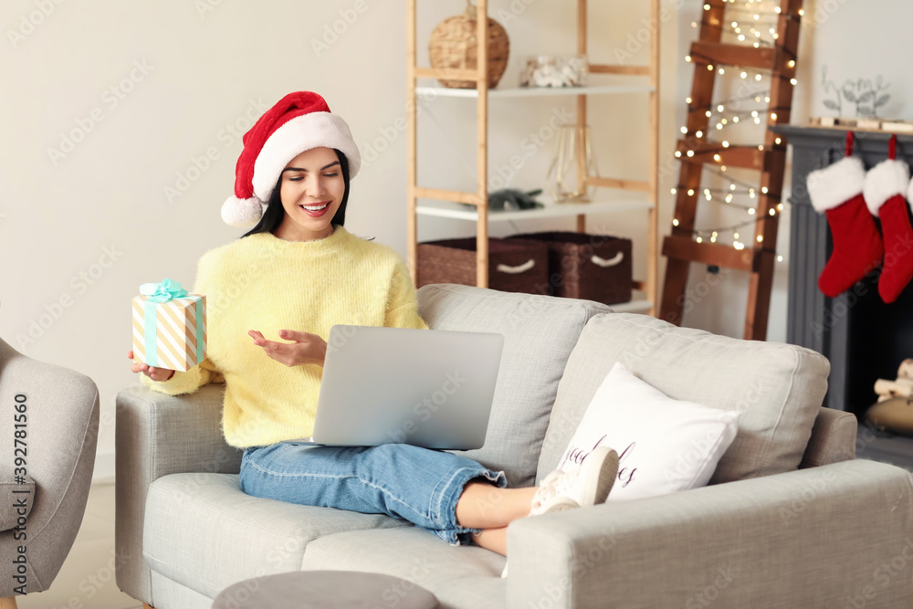 Young woman celebrating Christmas at home due to coronavirus epidemic Young woman celebrating Christmas at home due to coronavirus epidemic