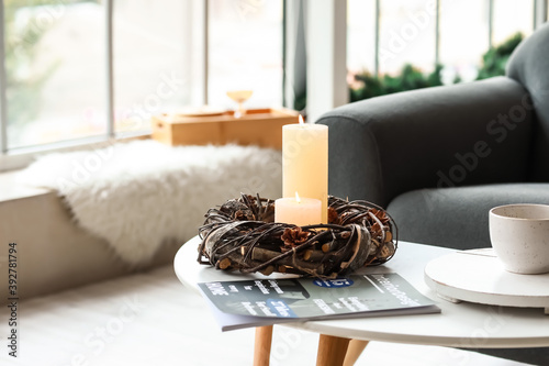 Burning candles and magazin...