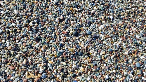 Beach sand and pebbles texture backgrounf