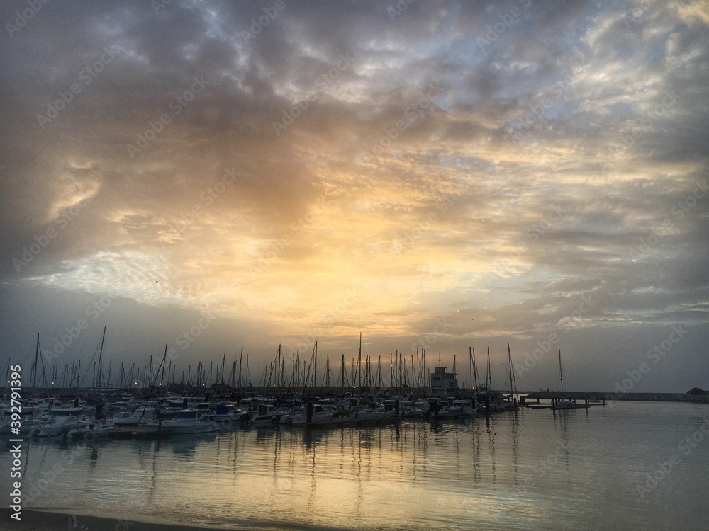 sunset over the sea in the harbor in Rota, Spain