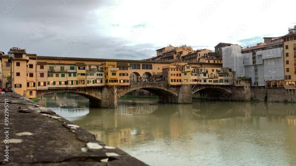 Slow pan right shot of Ponte Vecchio on cloudy day. Florence Slow pan right shot of Ponte Vecchio on cloudy day. Florence