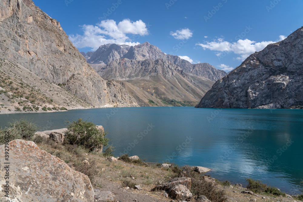 Turquoise blue Marguzor lake in scenic mountain landscape, Seven Lakes area, Shing river valley, near Penjikent or Panjakent, Sughd province, Tajikistan