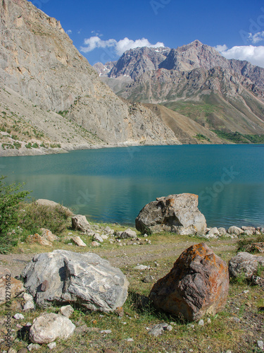 Turquoise blue Marguzor lake in scenic mountain landscape in the seven lakes area, Shing river valley, near Penjikent or Panjakent, Sughd province, in Tajikistan