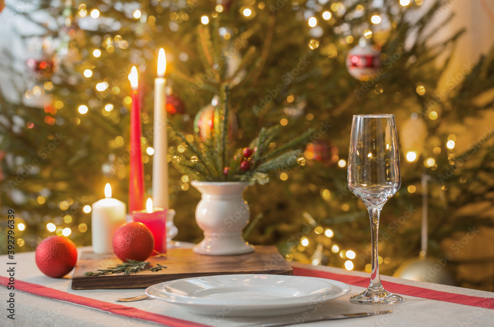 Christmas table with candles on background fir