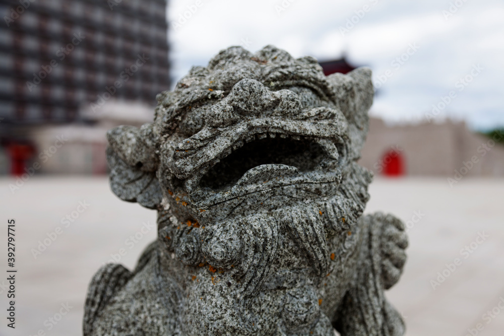 gaping Chinese lion figure in stone gaping Chinese lion figure in stone