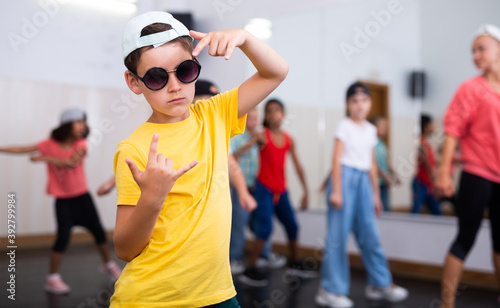 Boy hip-hop dancer posing at studio. High quality photo