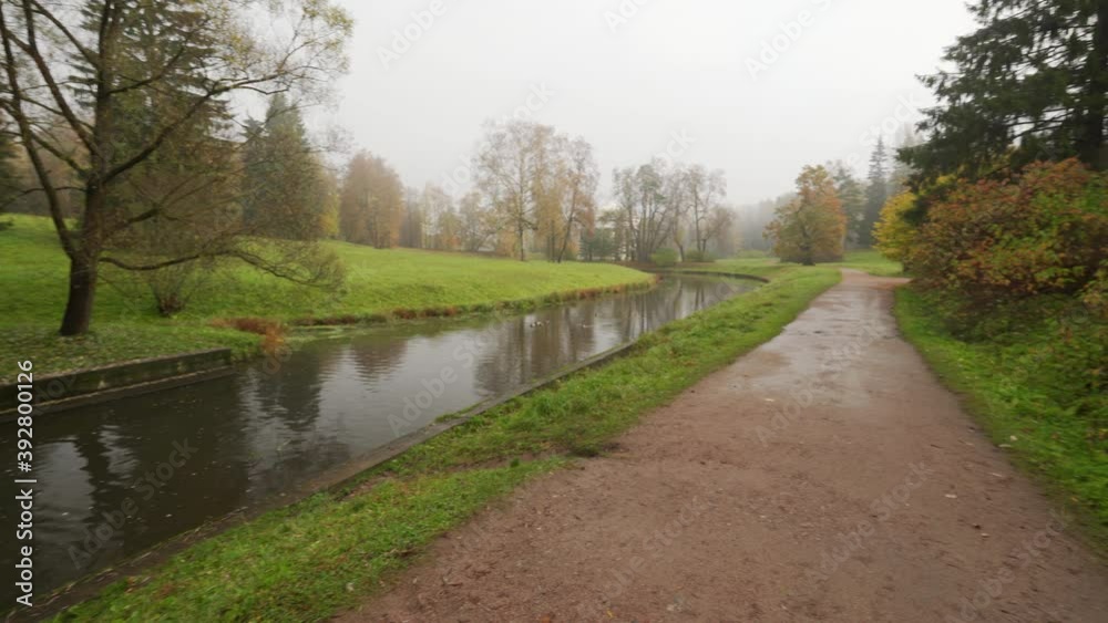 Walking on the path in magic Pavlovsk Park, morning autumn landscape, St. Petersburg, Russia. Walking on the path in magic Pavlovsk Park, morning autumn landscape, St. Petersburg, Russia.