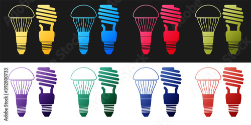Set Economical LED illuminated lightbulb and fluorescent light bulb icon isolated on black and white background. Save energy lamp. Vector.