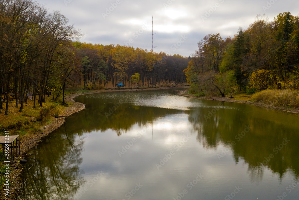 Fototapeta premium Aerial view of small lake in the forest.