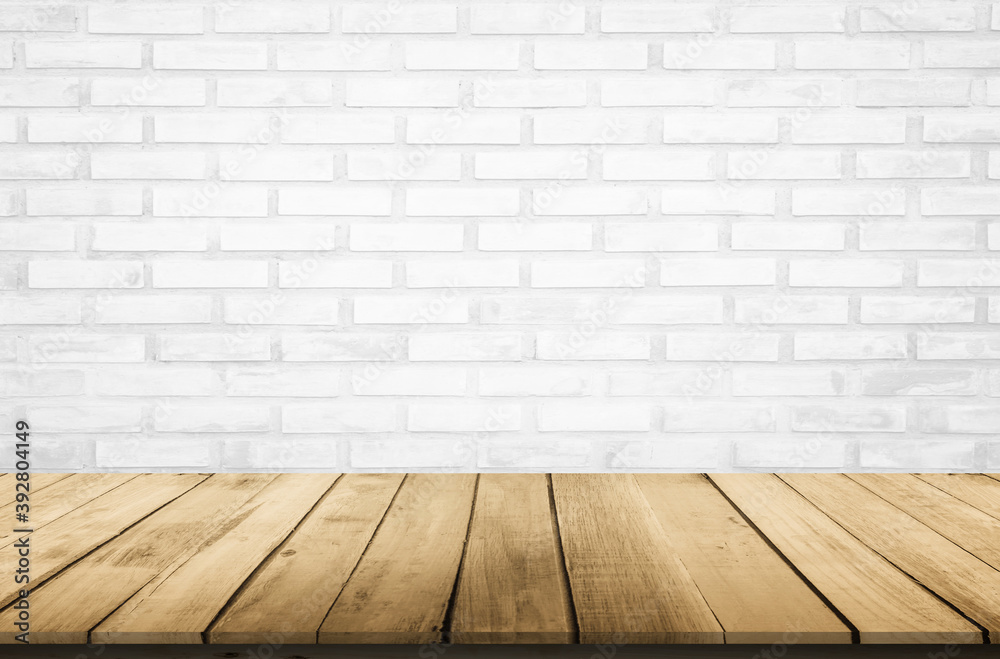 Empty wooden table top on white brick wall background, Design wood terrace white. Perspective for show space for your copy and branding. Can be used as product display montage. Vintage style concept.