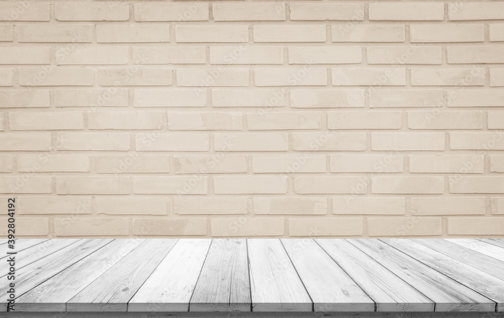Empty wooden table top on cream brick wall background, Design wood terrace white. Perspective for show space for your copy and branding. Can be used as product display montage. Vintage style concept.
