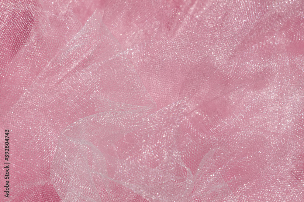 Pink tulle fabric texture top view. Coral background. Fashion color trends feminine tutu skirt flat lay, female blog backdrop for text signs desidgn. Girly abstract wallpaper, textile surface. - obrazy, fototapety, plakaty 