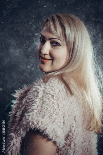 Attractive plump woman studio portrait close up view. photo