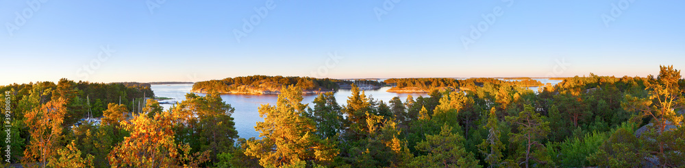Fototapeta premium Panoramic photo of Swedish nature archipelago during late summer, evening sunset.