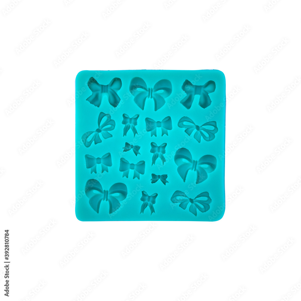 Blue silicone form isolated on white background. Silicone mold, bakeware. Top view, flat lay Blue silicone form isolated on white background. Silicone mold, bakeware. Top view, flat lay