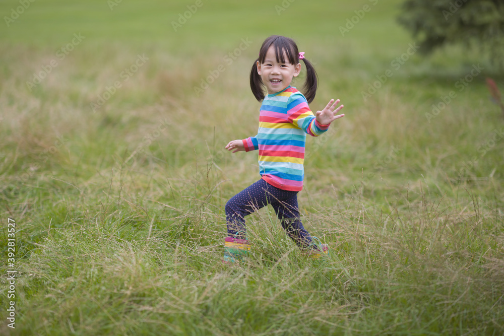 young girl playing in the summer forest park young girl playing in the summer forest park