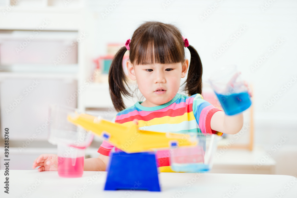 young girl play balance toy for homeschooling young girl play balance toy for homeschooling