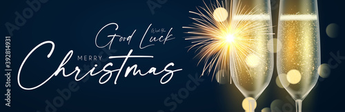 Shining champagne. Merry Christmas and Happy New Year design template with gold champagne glasses, light and bokeh effect