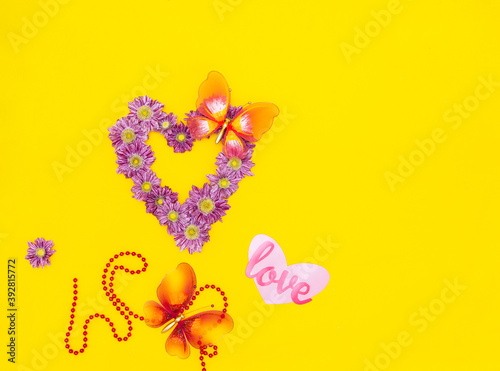 heart of fresh flowers pink chrysanthemums on a bright yellow background with space for text © Анастасия Клевакова