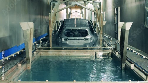 Car body electrophoretic coating process at a car manufacturing facility photo