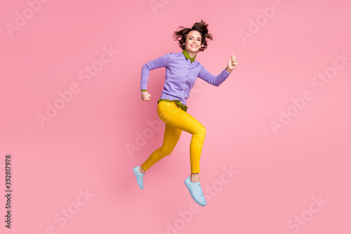 Full size profile side photo of girl jump run fast autumn discounts wear sneakers isolated pastel color background