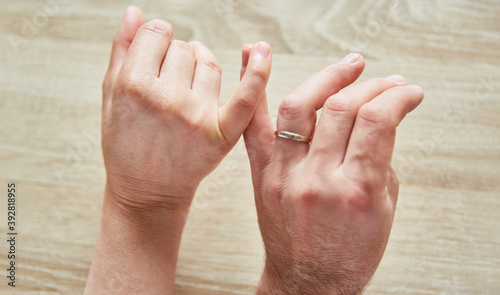 Hands of a woman and man are touching © Robert Kneschke