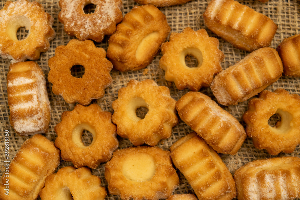 Homemade shortbread cookies on coarse burlap. Close up. Tea party.