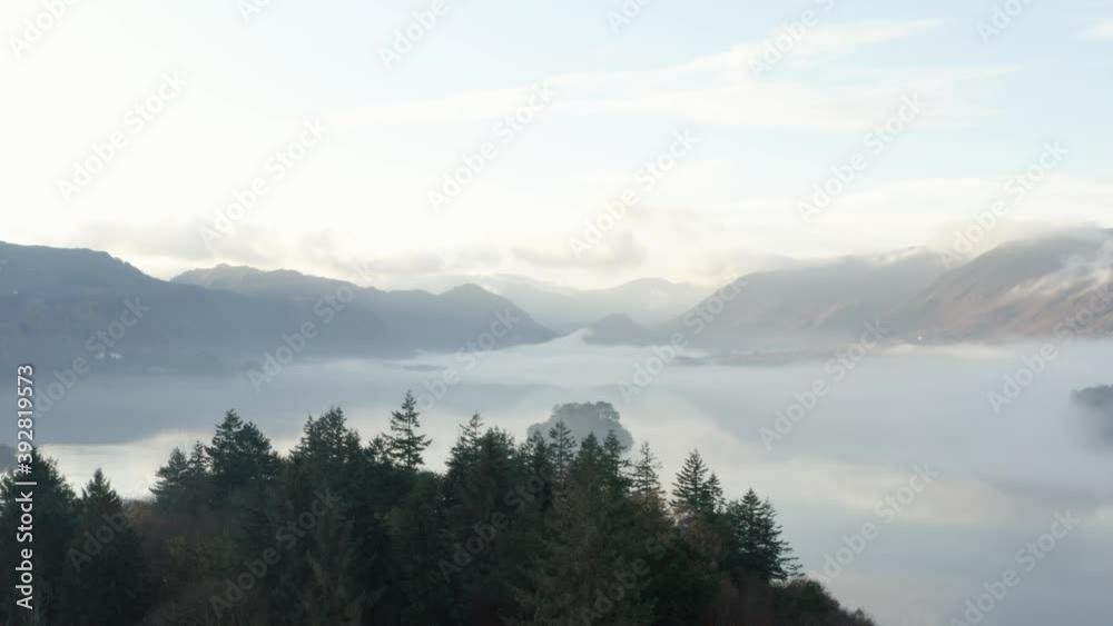 Misty morning over the Lake District, flying over the treetops to reveal landscape 4K Misty morning over the Lake District, flying over the treetops to reveal landscape 4K