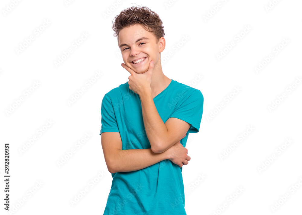 Handsome teen boy laughing looking very happy, isolated on white background Handsome teen boy laughing looking very happy, isolated on white background