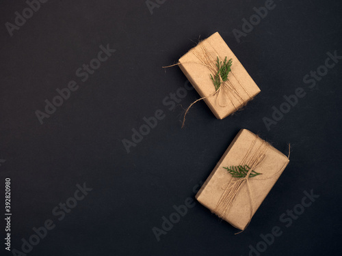 Christmas gifts with christmas decoration on black background.